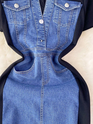Denim patchwork short-sleeve dress with button-down front and black side panels.