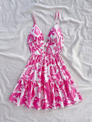 Vibrant floral cutout mini dress with tiered ruffle hem and spaghetti straps.