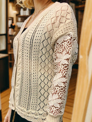 Tan knit cardigan with diamond pattern and lace sleeves