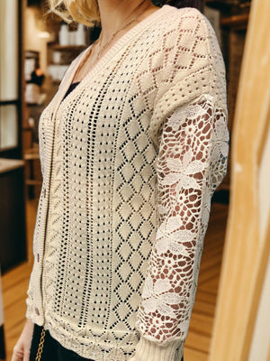 Tan knit cardigan with diamond pattern and lace sleeves