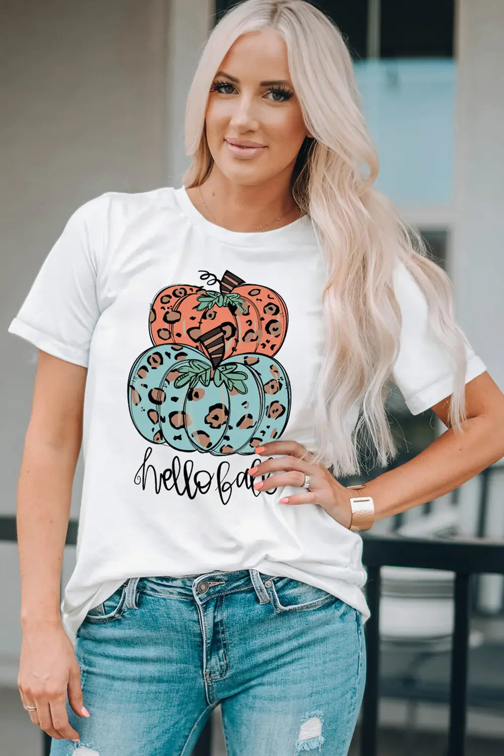 White t-shirt with stacked leopard print pumpkins and "hello fall" graphic
