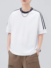 White oversized t-shirt with contrast stitching on sleeves and neckline.