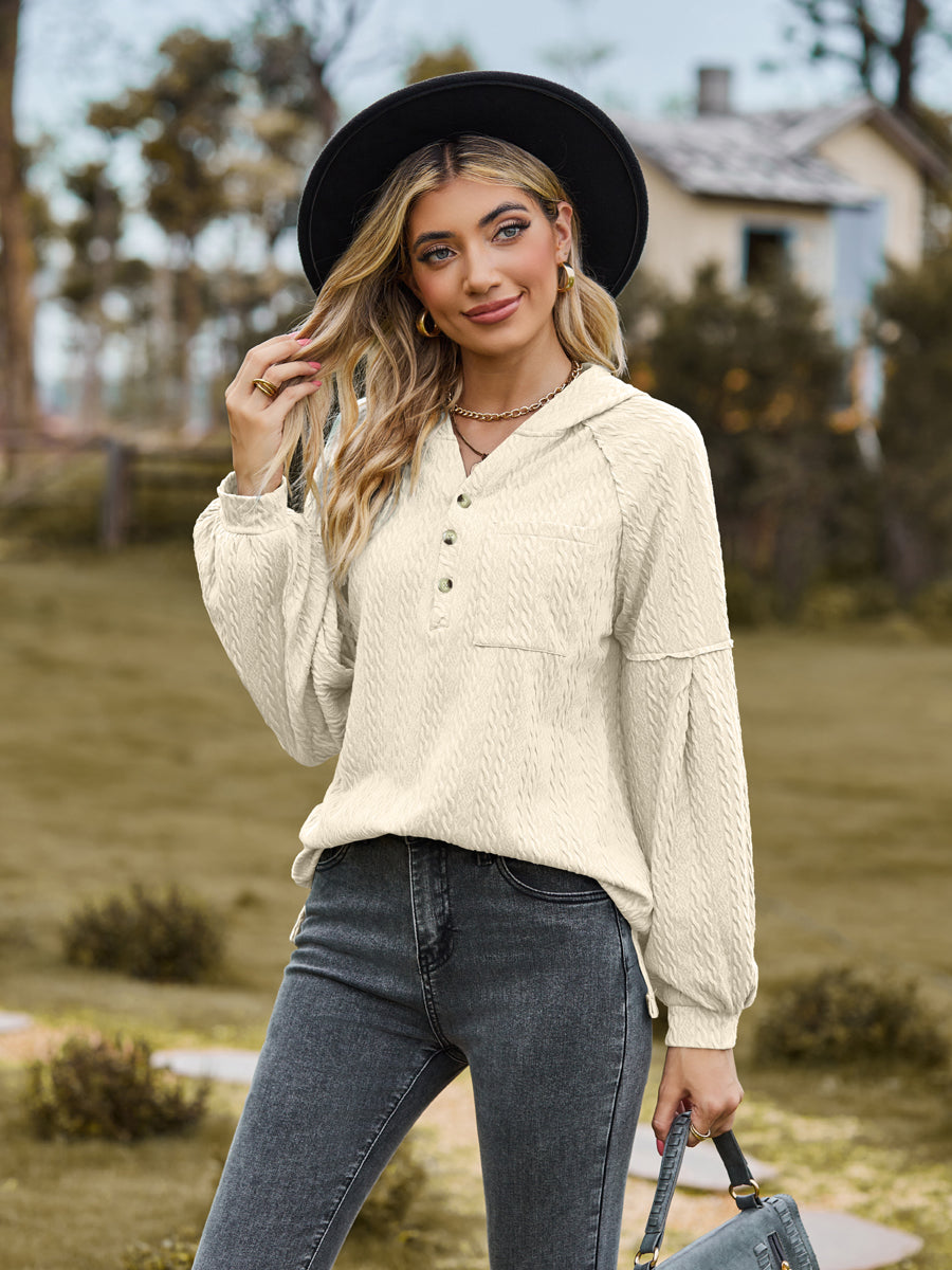 Cream textured knit henley with balloon sleeves and button detail