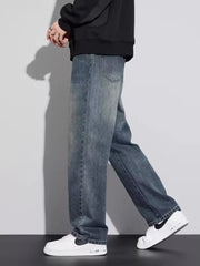Men's vintage wash relaxed fit jeans in blue cotton, casual style.