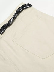 Cream white maternity pants with a black paisley print braided belt detail.