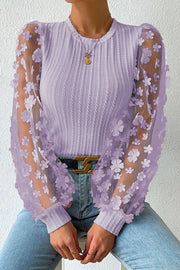 Lavender knit top with sheer floral appliqué sleeves and crew neck