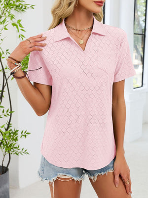Blush pink eyelet polo collar blouse with short sleeves and a chest pocket.