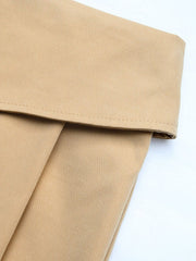 Tan skort shorts with a folded collar waist and pleats