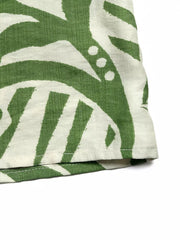 Tropical tie-front strapless jumpsuit in green and white abstract print.