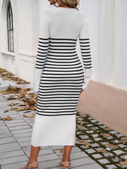 White and black striped knit midi dress with flared sleeves and a ribbed texture.