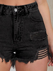 Black distressed denim cutoff shorts with ladder detailing and frayed hem.