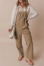 Camel corduroy wide-leg overalls with a bib front and adjustable straps.