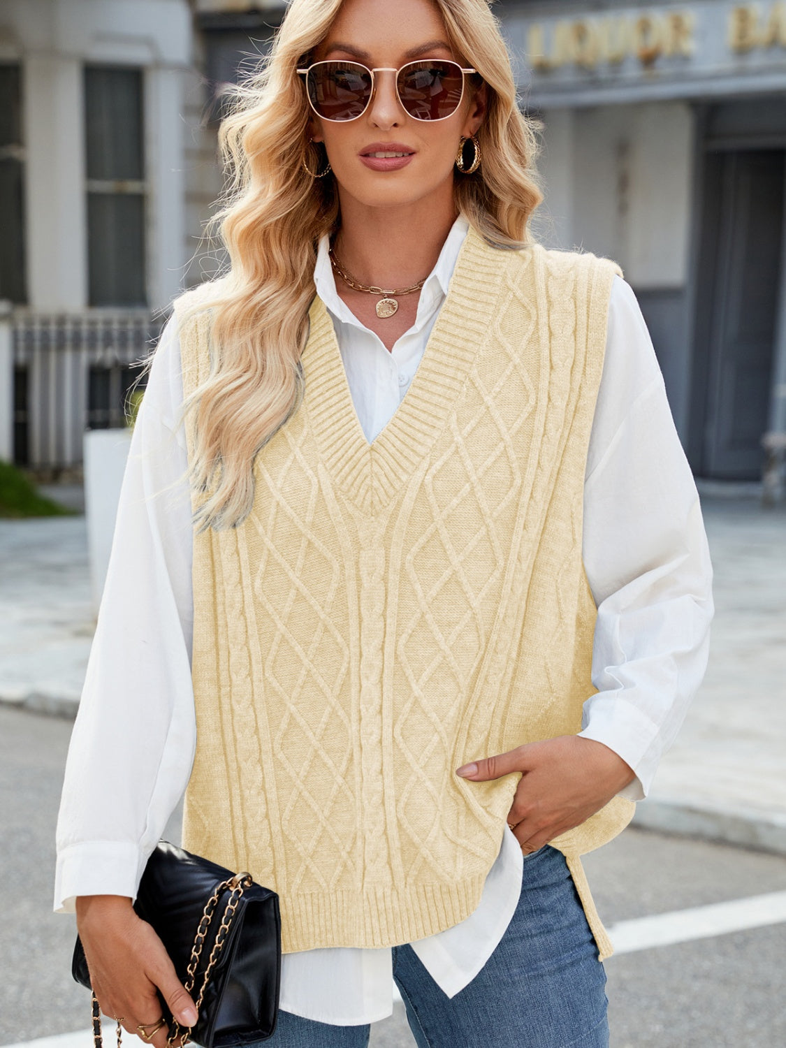 Cable knit v-neck sweater vest in tan with diamond pattern, acrylic material.