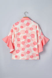 Polka dot babydoll blouse with ruffle trim sleeves and collar.