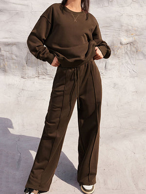 Brown seamed sweatshirt and wide-leg lounge pants set with drawstring waist and crew neck.