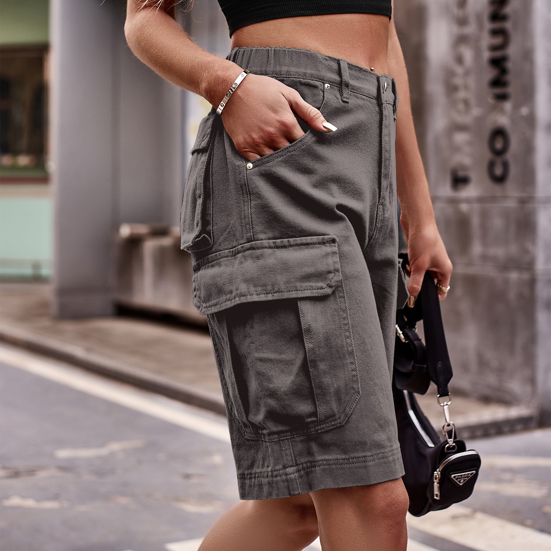 Dark gray denim cargo shorts with multiple pockets and a relaxed fit.