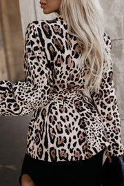 Leopard print wrap blazer with a belted waist and puff sleeves.