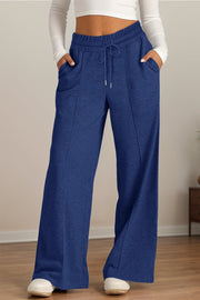 Navy seamed palazzo lounge trousers with drawstring waist and pockets.