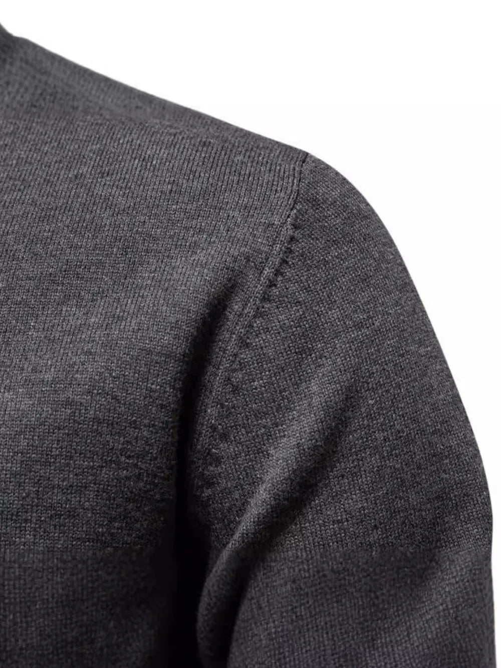Crew neck knit sweater in dark gray with ribbed texture detail on shoulder.