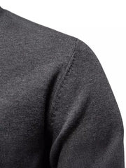 Crew neck knit sweater in dark gray with ribbed texture detail on shoulder.