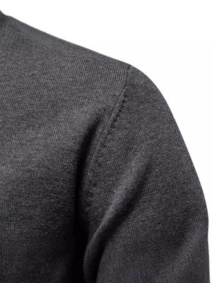 Crew neck knit sweater in dark gray with ribbed texture detail on shoulder.