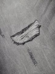 Men's distressed wide-leg jeans in grey cotton denim with frayed rips.