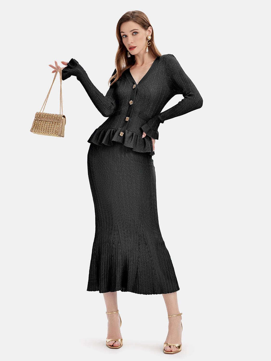 Black knit cardigan set with ruffled hem and flared skirt.