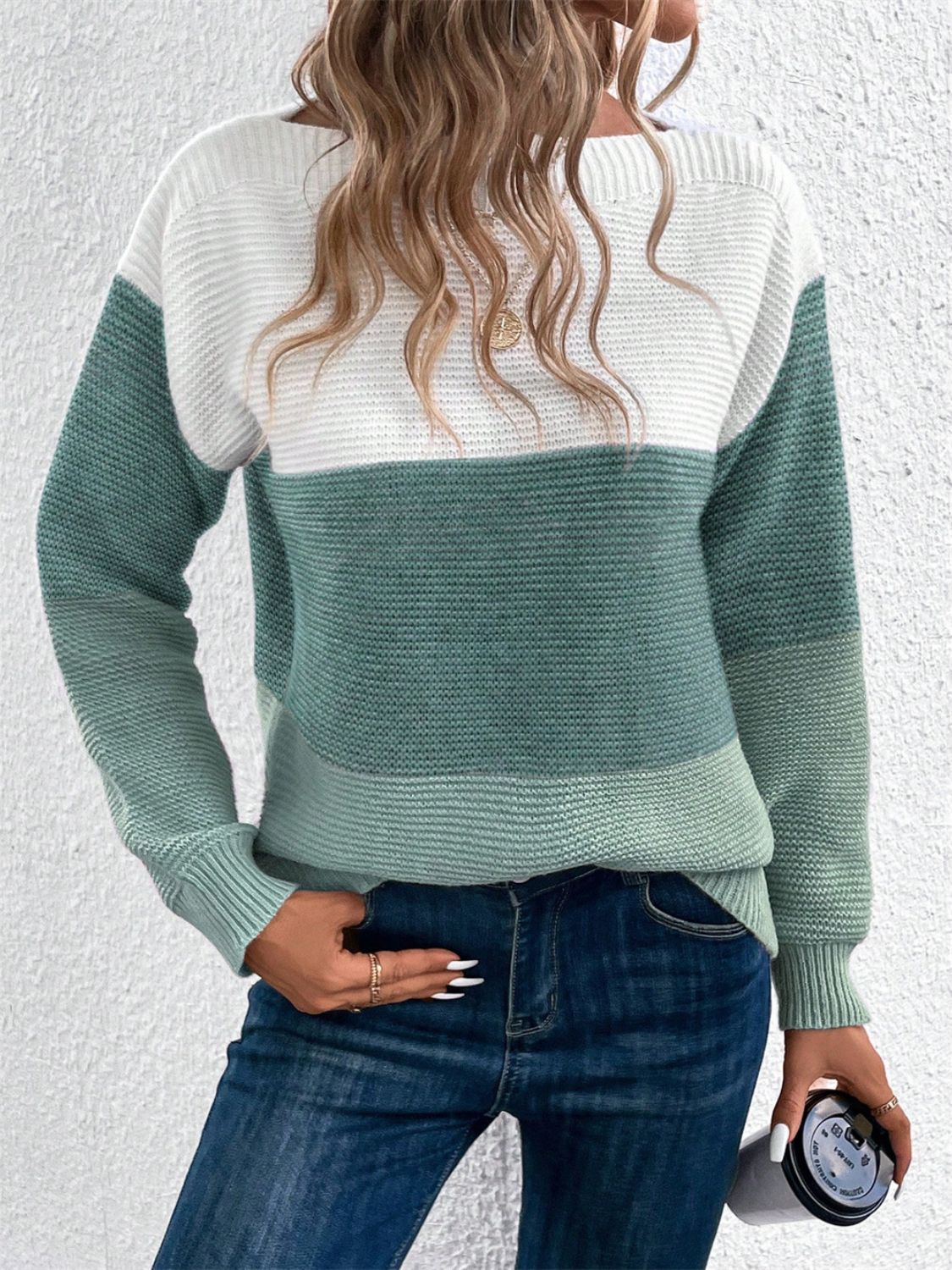 Colorblock boatneck knit sweater in white and Gum Leaf green acrylic with ribbed texture.