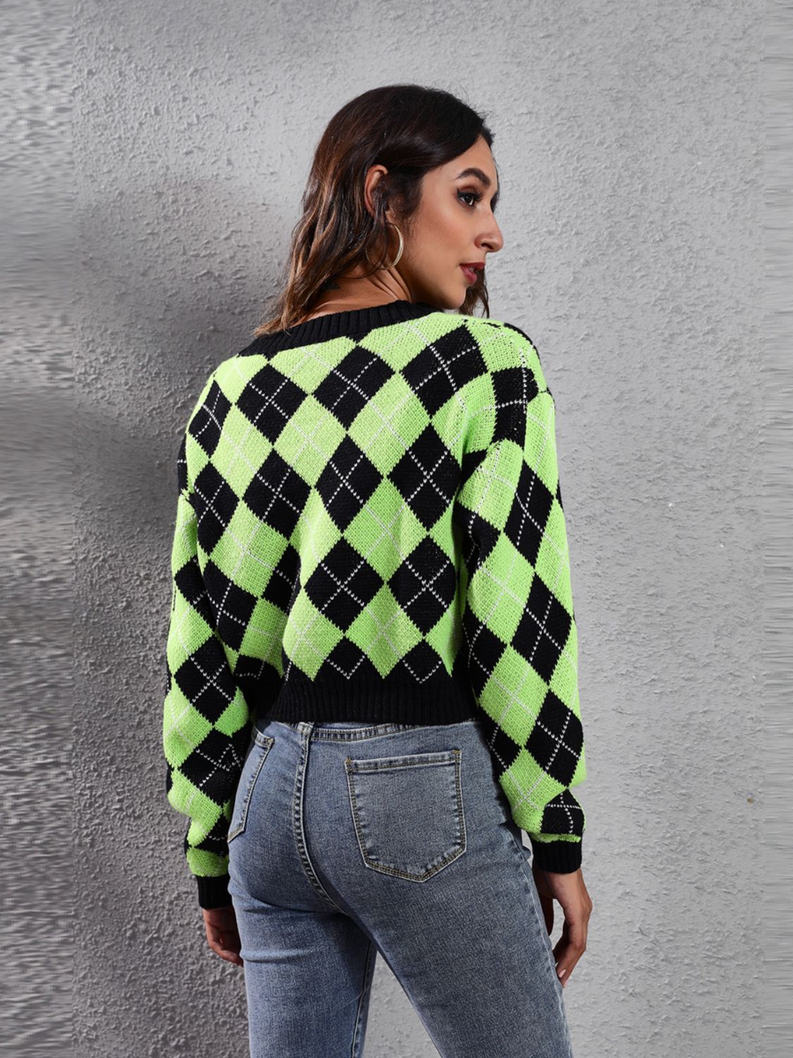 Argyle neon cropped cardigan with black trim and collar.
