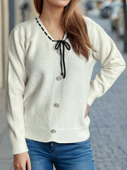 White knit cardigan with black ribbon trim and bow detail, button front, v-neck