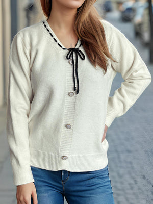 White knit cardigan with black ribbon trim and bow detail, button front, v-neck