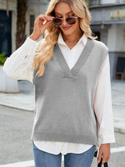 Gray ribbed knit v-neck sweater vest with striped trim detail.