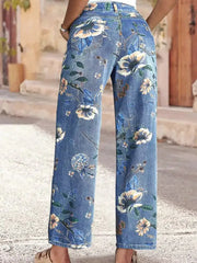 Light blue denim wide-leg jeans with a floral print and embellished details.