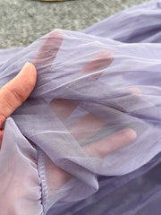 Purple tiered tulle skirt with lining, showing sheer fabric detail
