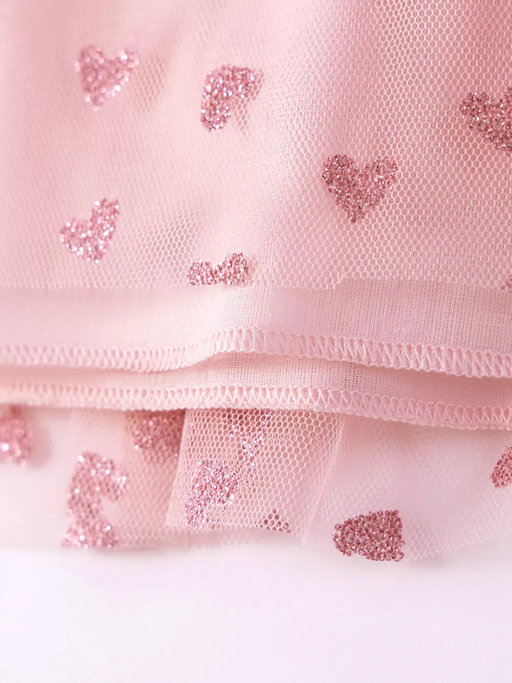 Pink tulle toddler dress with glitter heart details