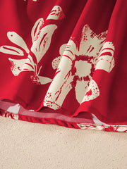 Red floral print blouse with bow tie detail, showing fabric texture and hem.