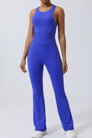 Blue cross-back flare leg unitard with ruched waist detail