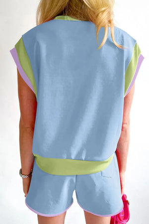 Light blue loungewear set with graphic trim and contrasting lime green waistband.