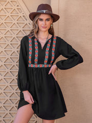 Black mini dress with embroidered yoke and long sleeves