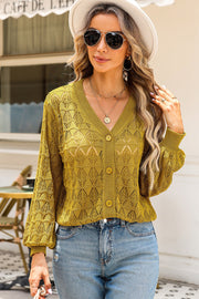 Chartreuse openwork knit cardigan with balloon sleeves and button front.