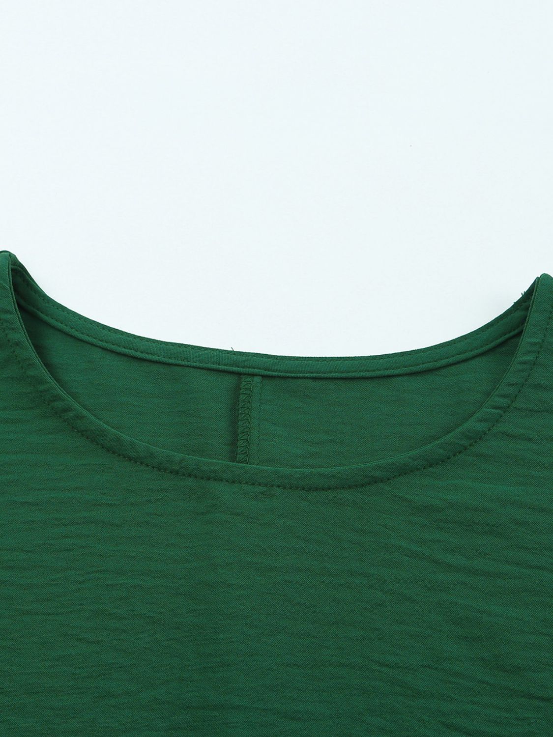 Dark green textured sleeve blouse with crew neck and elastic cuffs