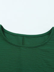 Dark green textured sleeve blouse with crew neck and elastic cuffs