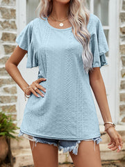 Light blue eyelet flutter sleeve blouse with round neckline and short sleeves.