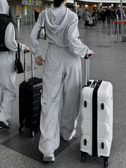 Light gray cropped zip hoodie and wide leg sweatpants set with a casual chic style.