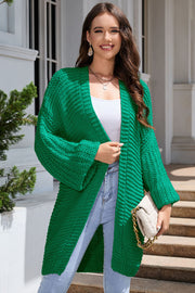 Mid Green textured knit cocoon cardigan with balloon sleeves and open front.