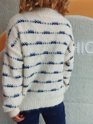 Textured stripe crew neck sweater in white with blue accents, acrylic knit.