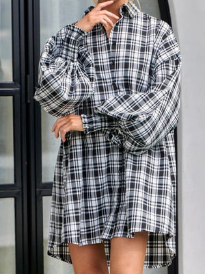 Plaid oversized shirt with balloon sleeves and cinched cuffs in black and white.