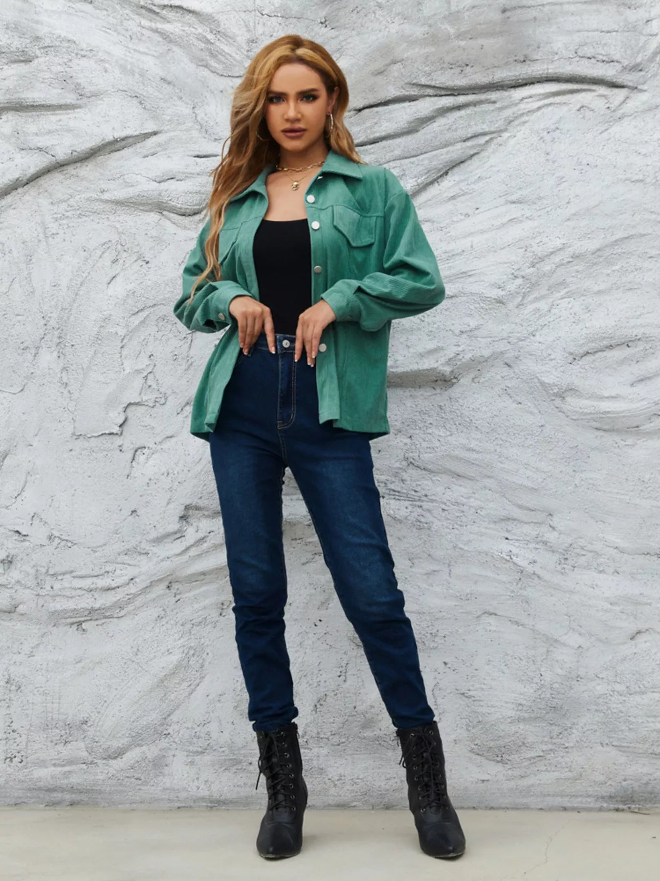 Textured corduroy button-up jacket in Peacock Green with chest pockets and button cuffs.