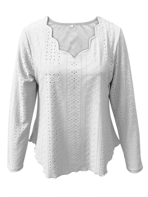 White scalloped eyelet yoke blouse with long sleeves and a V-neck.