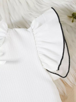 White baby top with ruffled sleeves and black trim detail